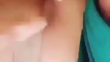 Horny girl squeezes her boobs and fingers her hairy pussy