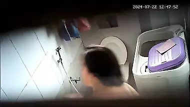 Aunty sitting in toilet and pissing before bathing