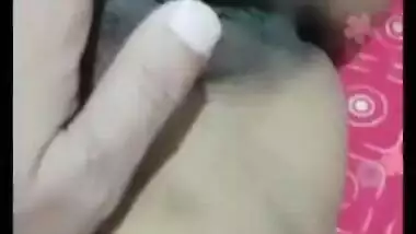 Desi gal grabs camera in time to record how she rubs own XXX pussy