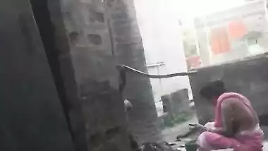 Voyeur - Indian BBW bathes outside